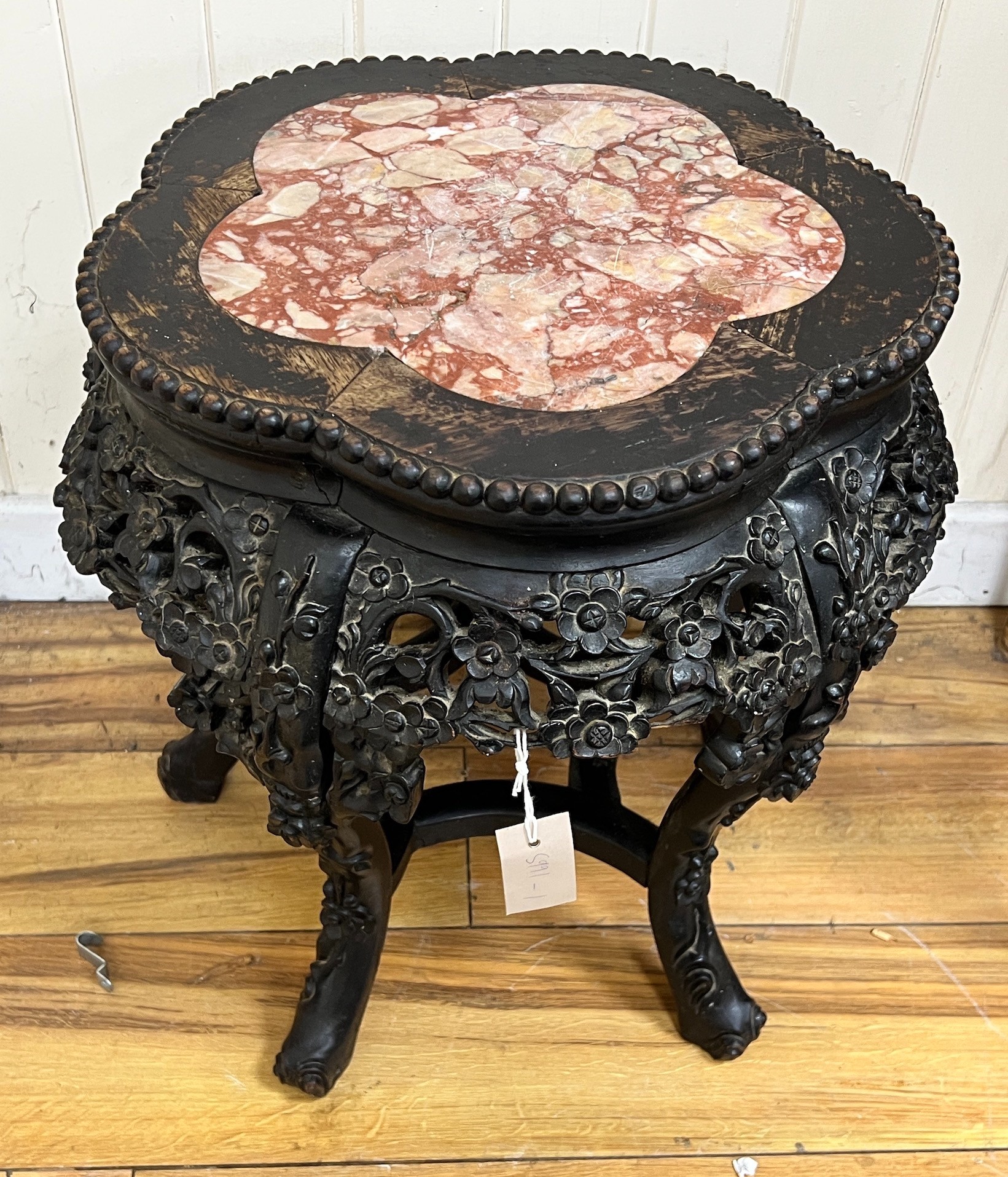 A Chinese carved hardwood marble topped jardinière stand, width 46cm, height 47cm